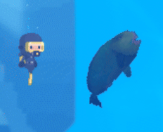A diver beside a large defeated fish underwater